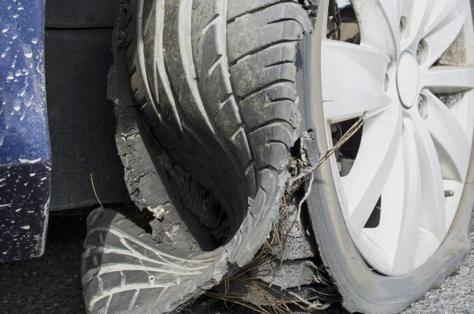 car tire with wires showing 
